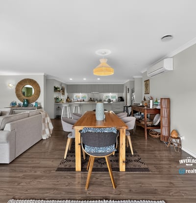 Spacious open-plan living and dining area, seamlessly connecting to a modern kitchen for effortless entertaining.