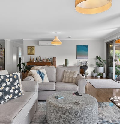 Bright and inviting living area featuring ample natural light, open space, and a seamless outdoor connection.