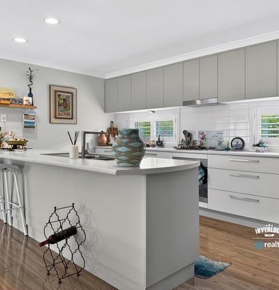 Modern kitchen featuring ample storage, sleek cabinetry, and a functional island, perfect for culinary enthusiasts.