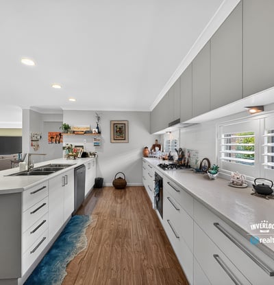 Modern kitchen featuring ample counter space, bright lighting, and a layout ideal for entertaining.