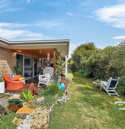 Bright outdoor space featuring lush gardens, inviting seating areas, and a peaceful atmosphere for relaxation.