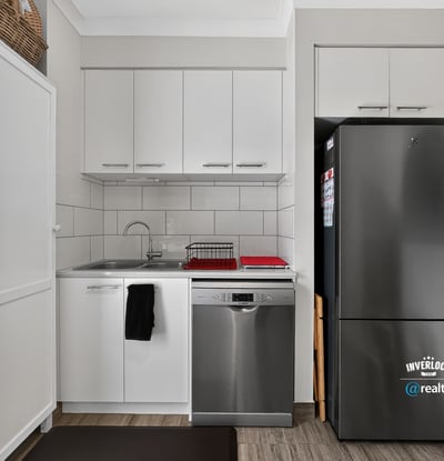 Modern kitchen equipped with stainless steel appliances and efficient design for seamless meal preparation.