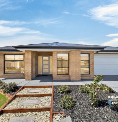 Spacious single-level home featuring modern architecture and easy-maintenance landscaping, set in a desirable neighborhood.