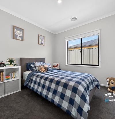 Bright, inviting bedroom featuring cozy decor, natural light, and ample space for personal touches.