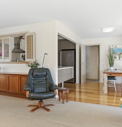 Bright and spacious living area features natural light and a seamless flow to the kitchen and dining space.