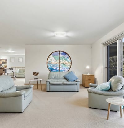 Spacious living area featuring large windows and scenic views, perfect for relaxation and entertaining.