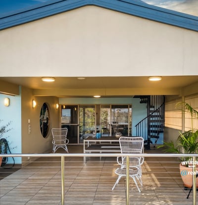 Spacious outdoor living area with panoramic views, perfect for entertaining or relaxing year-round.