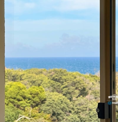 Enjoy breathtaking ocean views and lush greenery from this beautifully positioned window in your new home.
