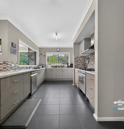 Spacious kitchen featuring modern appliances, ample storage, and natural light, perfect for culinary enthusiasts.