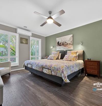 Bright and inviting bedroom featuring modern amenities and a tranquil view, perfect for relaxation.