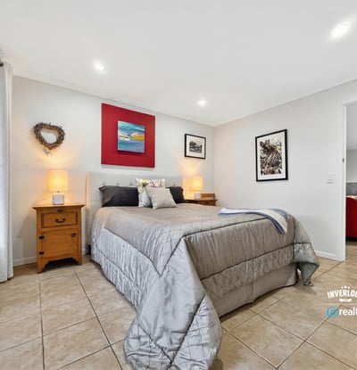 Spacious bedroom featuring modern decor, natural light, and ample storage for a comfortable living experience.