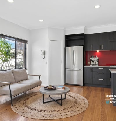 Modern kitchen and inviting living area with natural light, perfect for comfortable daily living.