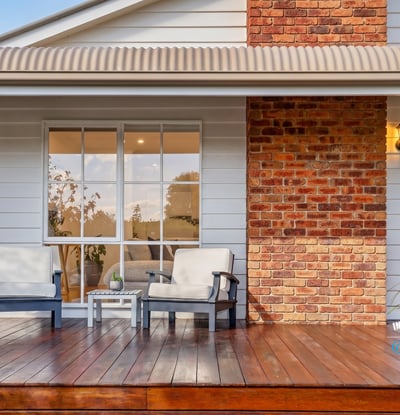 Relax on the spacious deck, featuring inviting seating and a blend of modern and classic design.