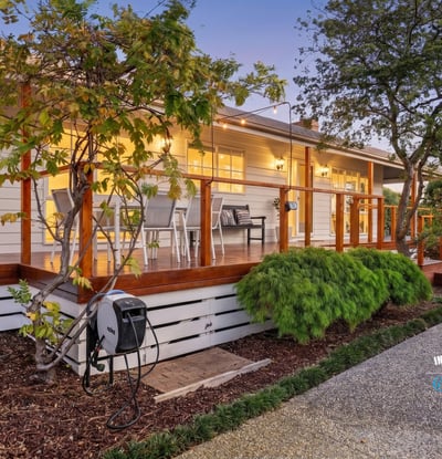 Discover this inviting home featuring a spacious deck, landscaped gardens, and modern amenities throughout.
