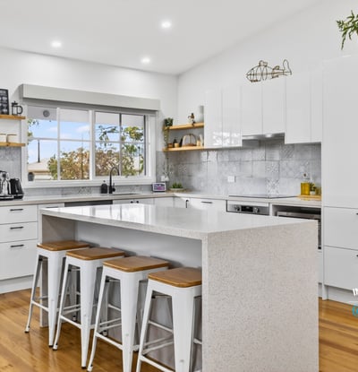 Bright, modern kitchen featuring sleek cabinetry, stainless steel appliances, and a spacious island for entertaining.