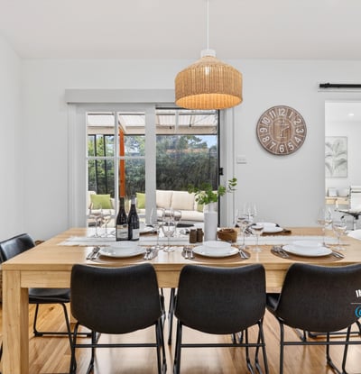 Bright dining area featuring natural wood accents, perfect for gatherings and everyday meals with family.