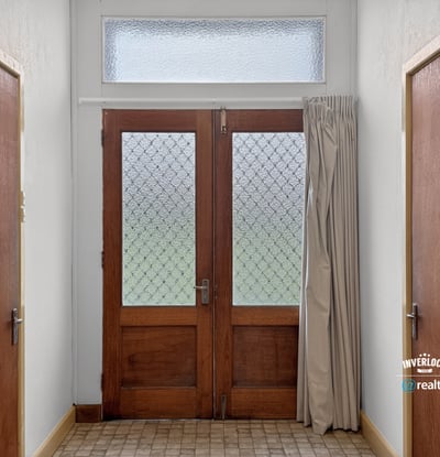 Bright entryway featuring distinctive glass doors and abundant natural light, welcoming you into the home.