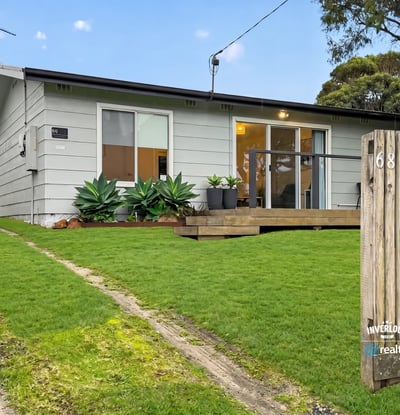 This cozy home features a spacious yard, modern design elements, and convenient access to local amenities.