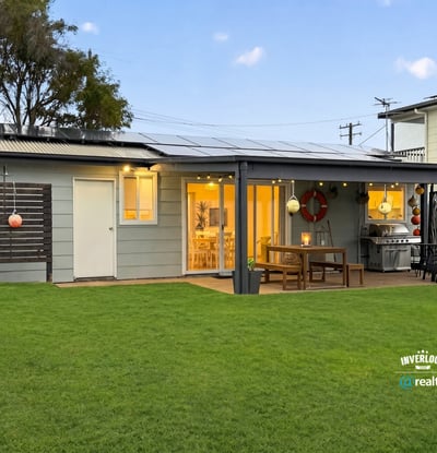 This modern home features a spacious yard, inviting patio area, and ample natural light throughout.