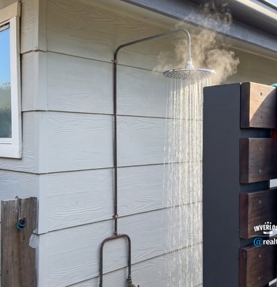Experience outdoor living with this unique outdoor shower, perfect for refreshing after a day at the beach.
