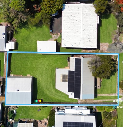 Spacious lot with ample outdoor space, featuring a well-maintained home and multiple storage options close to amenities.