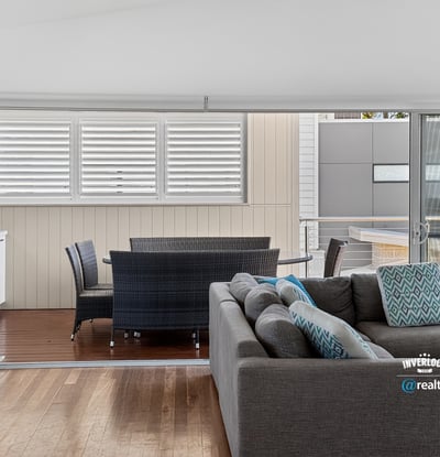 Bright and spacious living area seamlessly connects to a private outdoor space, perfect for relaxation.