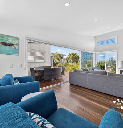 Modern open-concept living space featuring ocean views, ideal for entertaining and relaxation.