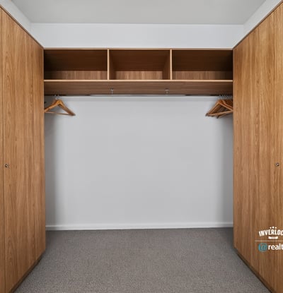 Spacious closet featuring ample storage with built-in shelving and hanging options for efficient organization.