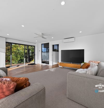 Bright and spacious living area with large windows, offering panoramic views and seamless indoor-outdoor flow.