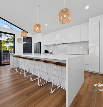 Modern kitchen featuring spacious design, sleek cabinetry, and ample natural light, perfect for entertaining.