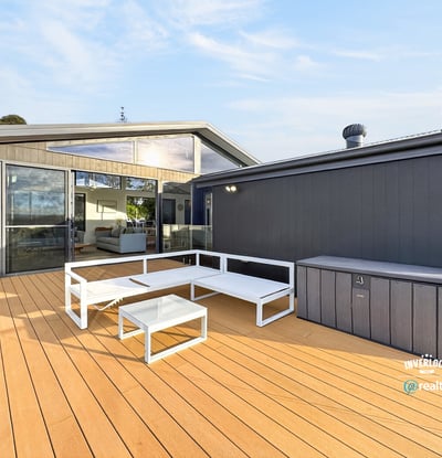 Spacious outdoor deck with modern seating, perfect for entertaining and enjoying views in a contemporary setting.