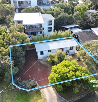 Spacious property surrounded by lush greenery, featuring potential for expansion and convenient access to amenities.