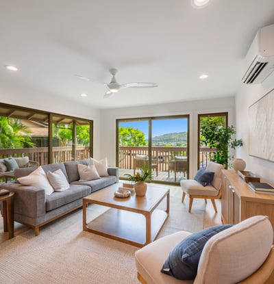 Bright and airy living space featuring panoramic views, modern furnishings, and seamless indoor-outdoor flow.