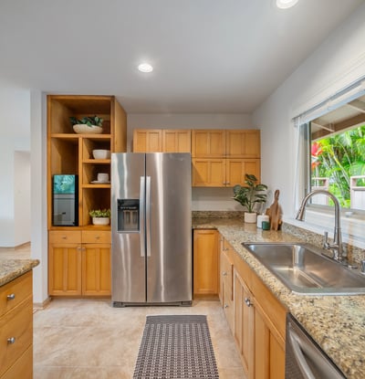 Modern kitchen featuring sleek stainless steel appliances, ample storage, and a bright, open layout.