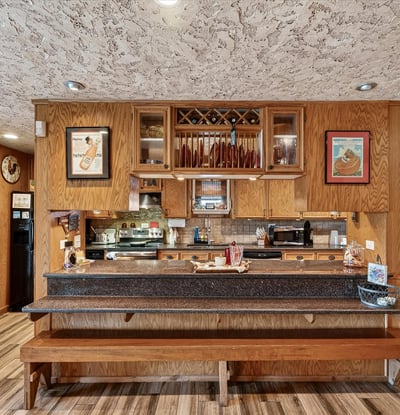 This inviting kitchen features ample counter space and a unique design, perfect for gatherings and culinary creativity.
