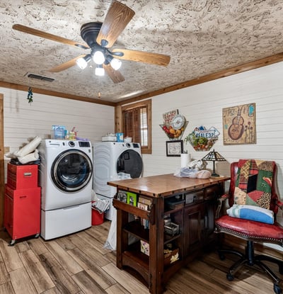 Bright laundry room features ample workspace for everyday tasks.
