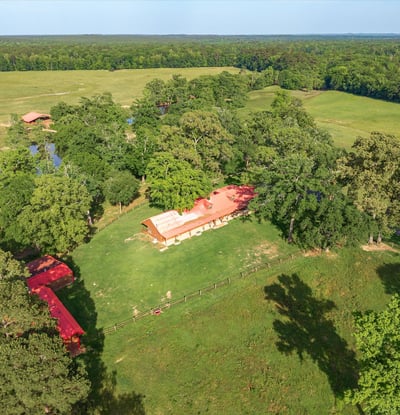 Sprawling acreage features a spacious home, ample outdoor space, and stunning natural surroundings—ideal for country living.