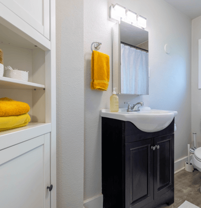 Bright bathroom featuring modern fixtures, ample storage, and warm tones for a welcoming atmosphere.