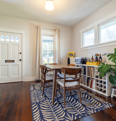 Bright dining area featuring natural light, modern decor, and a cozy atmosphere perfect for gatherings.
