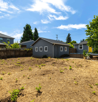 Spacious lot with potential, featuring a well-maintained residence and ample outdoor space for gardening or recreation.