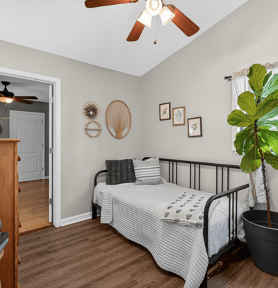 Bright and inviting bedroom featuring a cozy layout, and ample natural light.