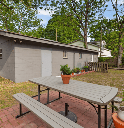 Spacious outdoor area features a picnic spot, perfect for gatherings and enjoying the natural landscape.