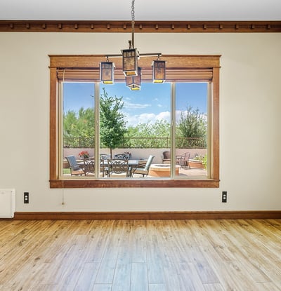 Enjoy natural light and peaceful outdoor scenes from this inviting dining area. Framed by Arts & Crafts trim, it's perfect for everyday meals or entertaining.