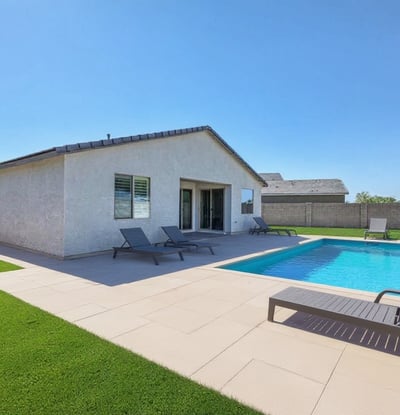 Virtually staged to showcase potential, this backyard rendering highlights space for a pool and lounging area. Imagine relaxing poolside in your custom-designed outdoor escape, right here in the heart of Peoria.