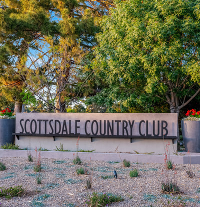 Beautifully landscaped entry to Scottsdale Country Club, offering golf, fitness, and community amenities for a resort-style lifestyle.