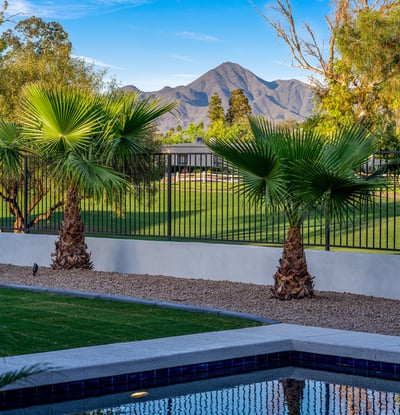 With mountain views, mature palms, and open golf course scenery, this backyard offers a quintessential Scottsdale lifestyle.