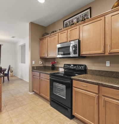 A beautiful combination of form and function, this kitchen offers plenty of prep areas and direct access to the dining and great rooms.