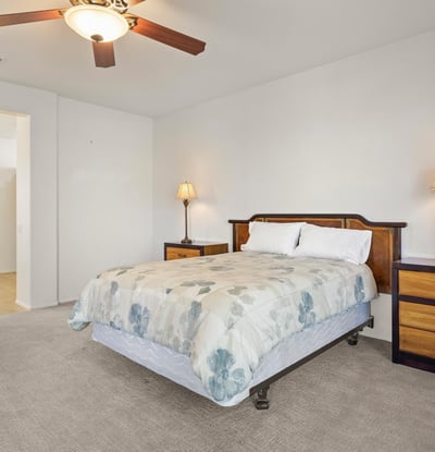 This bright and spacious primary suite combines comfort and function, with direct access to the ensuite bath and generous natural lighting.