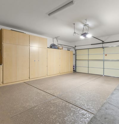 Extended garage with built-in cabinetry and workbench area, perfect for hobbyists, extra storage, or home projects.