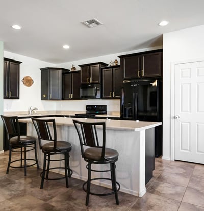 Breakfast bar seating area that adds casual dining space and enhances the kitchen s open-concept design.